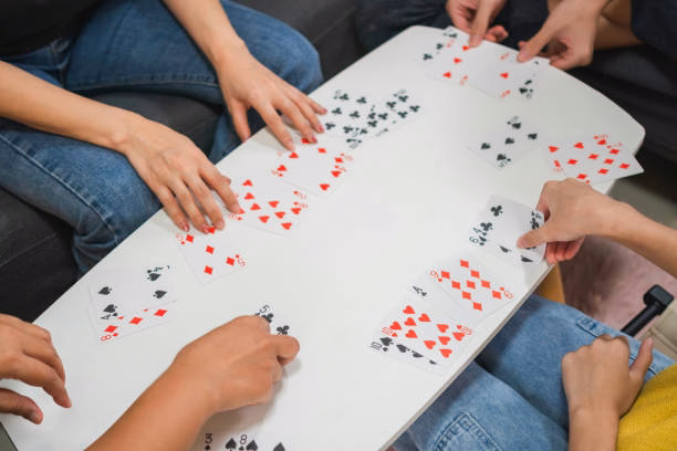 Family playing Teen Patti card game together
