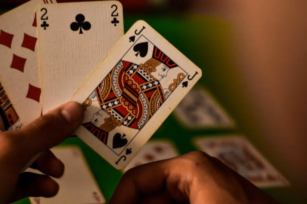Player carefully observing cards during Teen Patti round